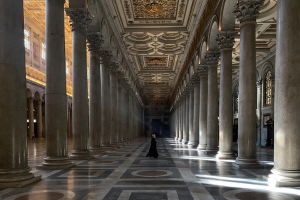 Priest walking through hall in the Vatican